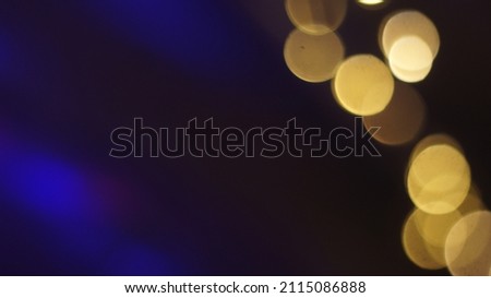 Blurred defocused bokeh overlay effect. Dark abstract background Copy space wallpaper or use screen mode to add beautiful texture to your photo.