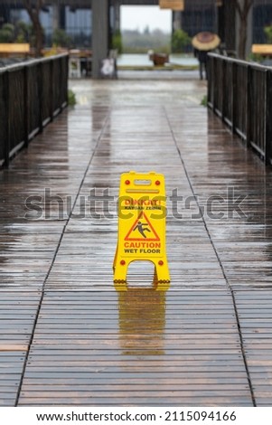 Yellow caution slippery floor sign