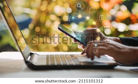Businessman with mobile smartphone in hand paying online and shopping on virtual interface global network, online banking and digital marketing.