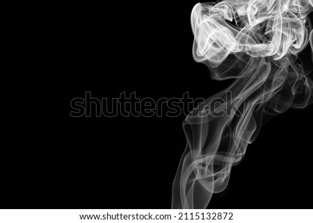 Abstract white smoke moving on black background.