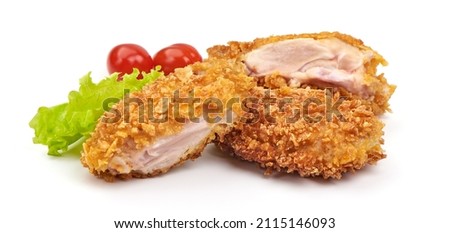 Delicious crispy chicken fillet in bread crumbs, isolated on white background Royalty-Free Stock Photo #2115146093