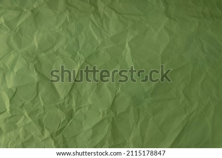crumpled paper. sheet of green paper. detailed high resolution texture. abstract background for wallpaper.