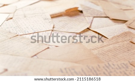 Table covered with many old letters. Angle view, selective focus