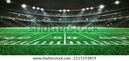 green field in american football stadium. ready for game in the midfield Royalty-Free Stock Photo #2115193859