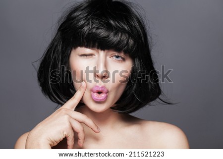 Close-up female face studio photo. woman posing