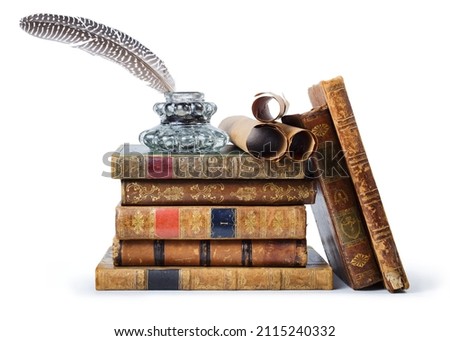 Antique books, inkwell with quill pen and old scrolls on white background  Royalty-Free Stock Photo #2115240332