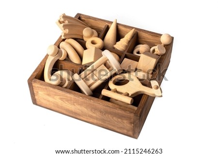 Set of wooden toys.Children's wooden toys on a white background The concept of learning and education. Set of retro cartoon scooter, car and designer, a tool kit.