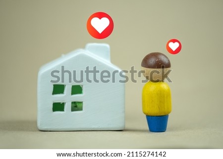 Model human and home with red heart-shaped.  Real estate and dream home concept