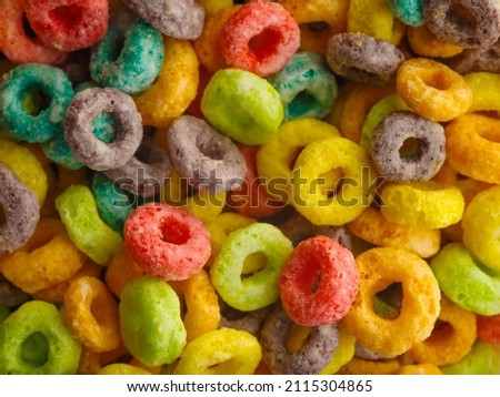 macro photography. Multi-colored crispy fruit rings snacks, breakfast, ready to eat. Healthy food. Quick satisfaction of hunger. Vitamins, minerals, fiber, sports, fitness, healthy lifestyle.