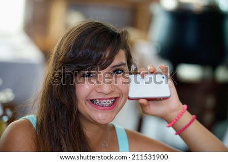 Happy beautiful girl with mobile phone