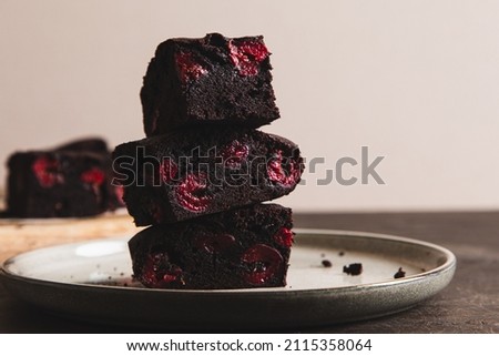 brownie with cherry. A stack of chocolate brownies, homemade bakery and dessert. Bakery, confectionery concept