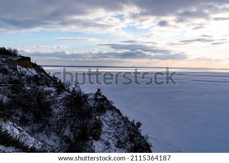 Mount Pivikha at sunset, view of the snow-covered Dnieper River