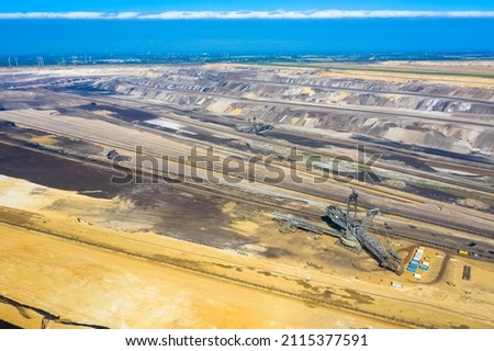 Garzweiler open cast mine, Jackerath.
Aerial panoramic view of the largest lignite mining factory in Europe located in North Rhine-Westphalia, Germany. Royalty-Free Stock Photo #2115377591