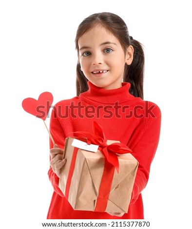 Funny little girl with gift and party decor on white background. Valentine's Day celebration
