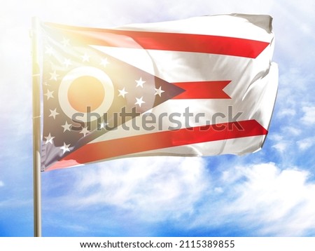 Flagpole with flag of State of Ohio.