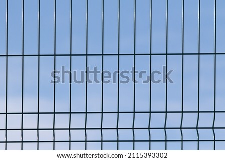 Metal lattice against the blue sky.