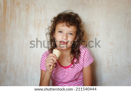 cute kid eating ice cream.