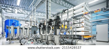Pump station for reverse osmosis industrial city water treatment station. Wide angle perspective. Technology, chemistry, heating, work safety, supply, infrastructure Royalty-Free Stock Photo #2115428537