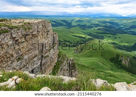 View of the mountains and the Bermamyt plateau in the Karachay-Cherkess Republic, Russia. Royalty-Free Stock Photo #2115440276