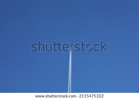 Airliner contrail in the blue sky