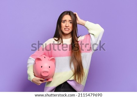young pretty woman feeling stressed, worried, anxious or scared, with hands on head, panicking at mistake Royalty-Free Stock Photo #2115479690