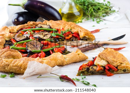 Eggplant pie with peppers and beans