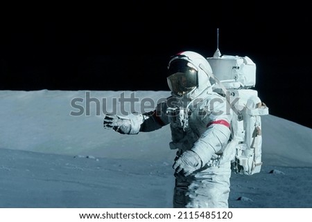 Astronaut on the moon, with galactic background. Elements of this image were furnished by NASA. High quality photo