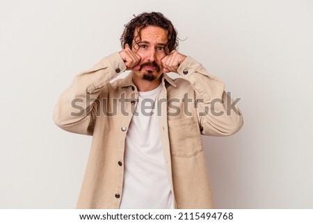 Young caucasian man isolated on white background whining and crying disconsolately. Royalty-Free Stock Photo #2115494768