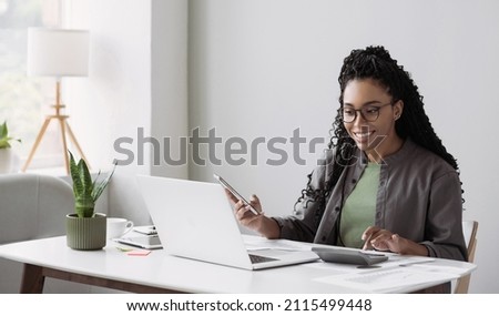 Young woman working in office. Businesswoman using laptop computer, working in office. Technology, business, distance studying, meeting online, e-learning, internet marketing, manager, entrepreneur Royalty-Free Stock Photo #2115499448