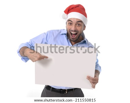 attractive business man wearing santa christmas hat holding and pointing blank billboard or placard sign copy space for adding text advertising corporate or xmas whishes isolated on white background
