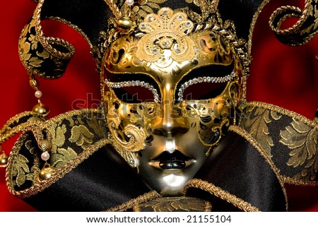 Ornate handmade venetian mask on red background