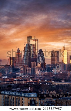 Beautiful sunrise view of the City of London with sunlight reflecting in the glas facade of the modern skyscrapers