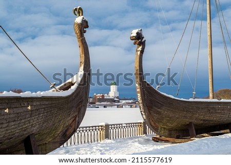 Drakkars (viking ships), medieval Vyborg Castle, Leningrad region, Russia, winter Royalty-Free Stock Photo #2115577619