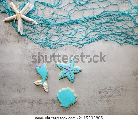 Mermaid theme sugar cookies with royal icing. Seashell, starfish and mermaid tail cookies.