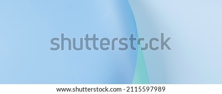Abstract geometry composition banner background in pastel blue, and green colors with geometric shapes and curved wave lines. Top view, copy space