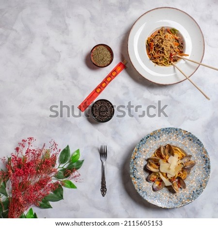 Delicious Asian food, know as ''Noodle'', mussel pasta, food styling top view, assorted tasty Asian meals on gray backdrop