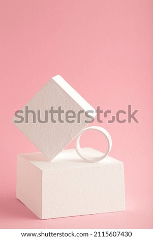 Abstract minimal scene with geometrical forms on pink background. Abstract background. Space for text. Top view