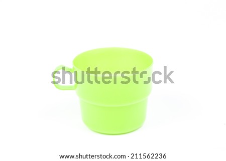 Green plastic glass on white isolated background.object on white isolated backgruond packshot.