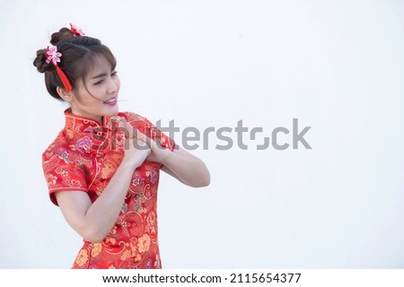 Portrait beautiful asian woman in Cheongsam dress on white background,Thailand people,Happy Chinese new year concept,Happy  asian lady in chinese traditional dress