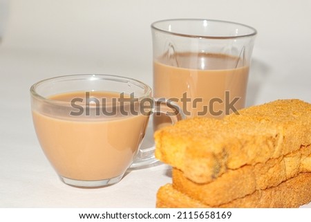 Rusk with cup of tea with white background.