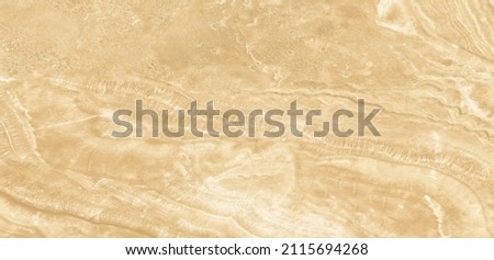 Golden marble texture background pattern top view. Tiles natural stone floor with high resolution. Luxury abstract patterns. Marbling design for banner, wallpaper, packaging design template.