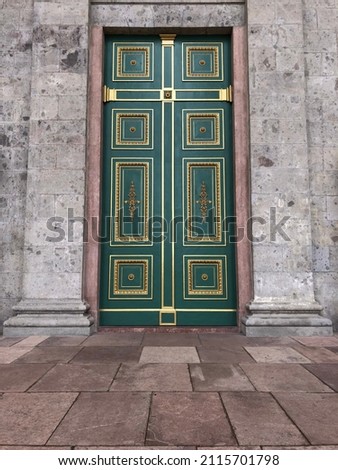 Amazing door With its magnificent green background, knocker-like spherical shapes and the embroidered shape on the gilded square frame door in Esztergom Basilica Hungary