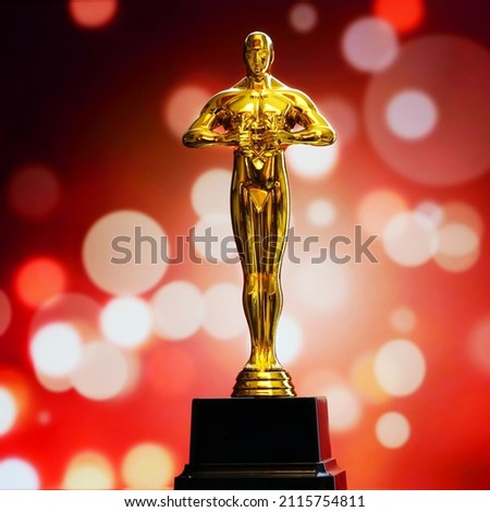 Hollywood Golden Oscar Academy award statue on light rays on black background with copy space. Success and victory concept. Royalty-Free Stock Photo #2115754811