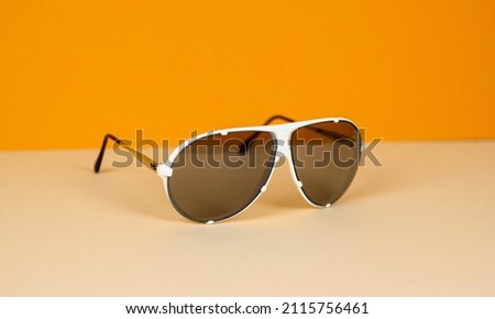 vintage sun glasses sunglasses 70s 1970 retro white style old sun object isolated design summer vision antique background accessory fashion eyeglasses space age mid century holiday aviation Royalty-Free Stock Photo #2115756461
