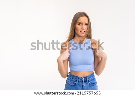 Young confident girl pointing with fingers at herself isolated over white