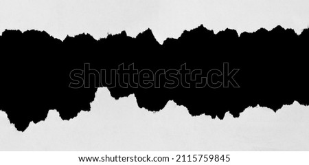 Ripped white paper on black background Royalty-Free Stock Photo #2115759845