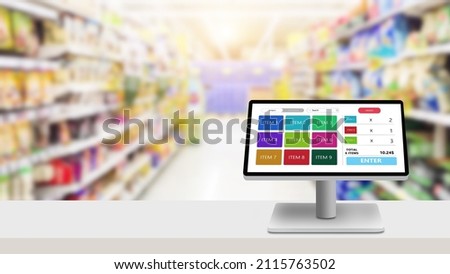 POS,Point of sale grocery or retail management system program concept.Modern touch screen cash register on white desk with blurred supermarket as background Royalty-Free Stock Photo #2115763502
