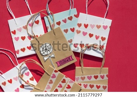 bags decorated with the technique of collage. Stamping with stamps and engravings. Craft to celebrate Valentine's Day. 