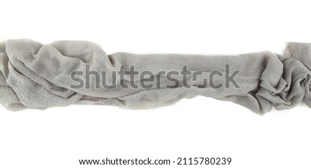 Natural cotton gauze table runner or baby shower fabric isolated on white  background. Gauze cheesecloth fabric texture top view. Royalty-Free Stock Photo #2115780239