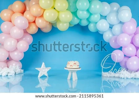 rainbow photography background with balloons, pastel on blue background